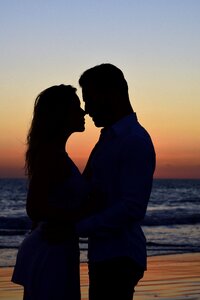 Beach sunset couple photo