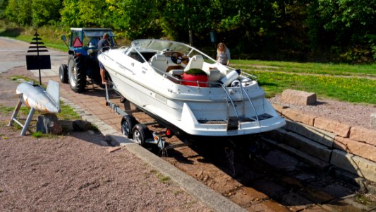 Getting the boat out of the water 6 - Boat on the trailer on dry land, ready to be towed by a car