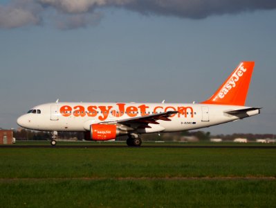 G-EZAG easyJet Airbus A319-111 - cn 2727 takeoff from Polderbaan, Schiphol (AMS - EHAM) at sunset photo