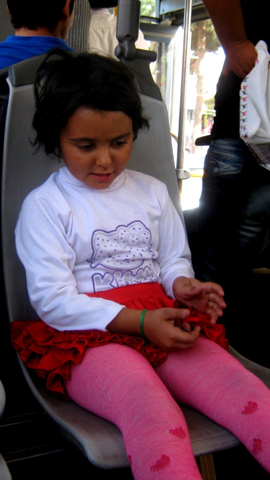 Girl sited on bus chair - Nishapur