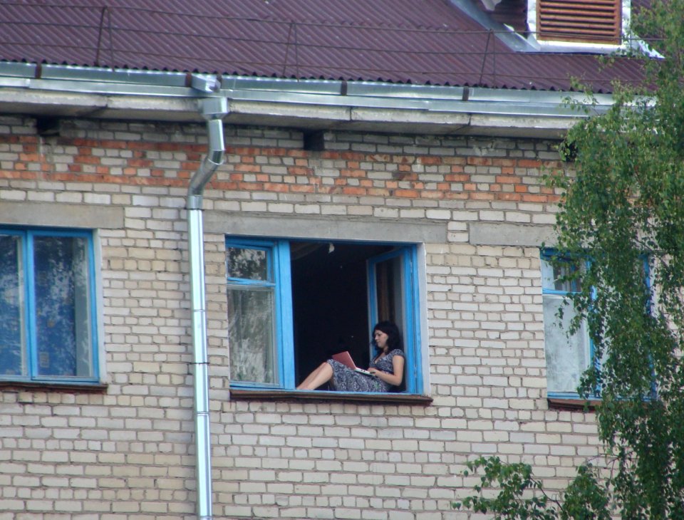 Girl sitting on the windowsill