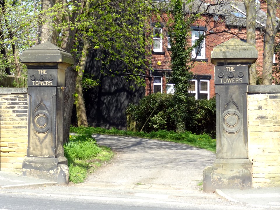 Gate Piers And Flanking Walls To The Towers