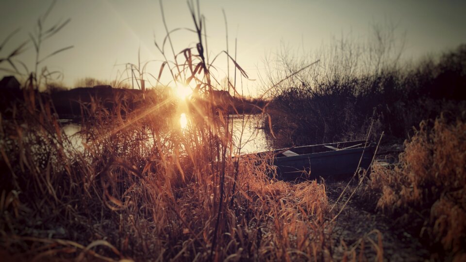 Wooden boat beach quiet river photo