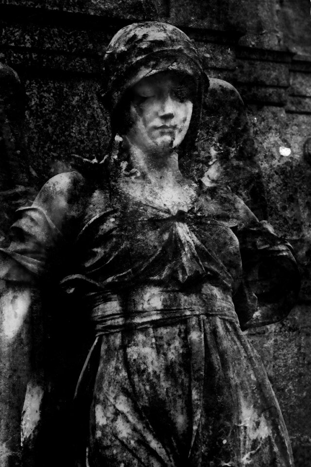 Dark statue grave