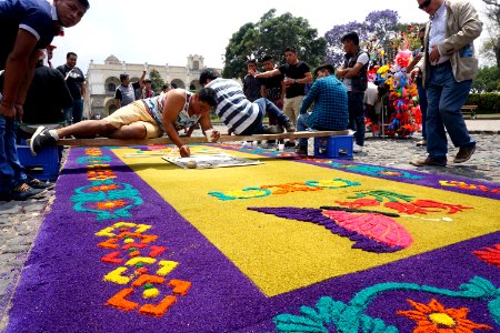 Guys preparing sawdust carpet for Semana Santa in Antigua, Guatemala