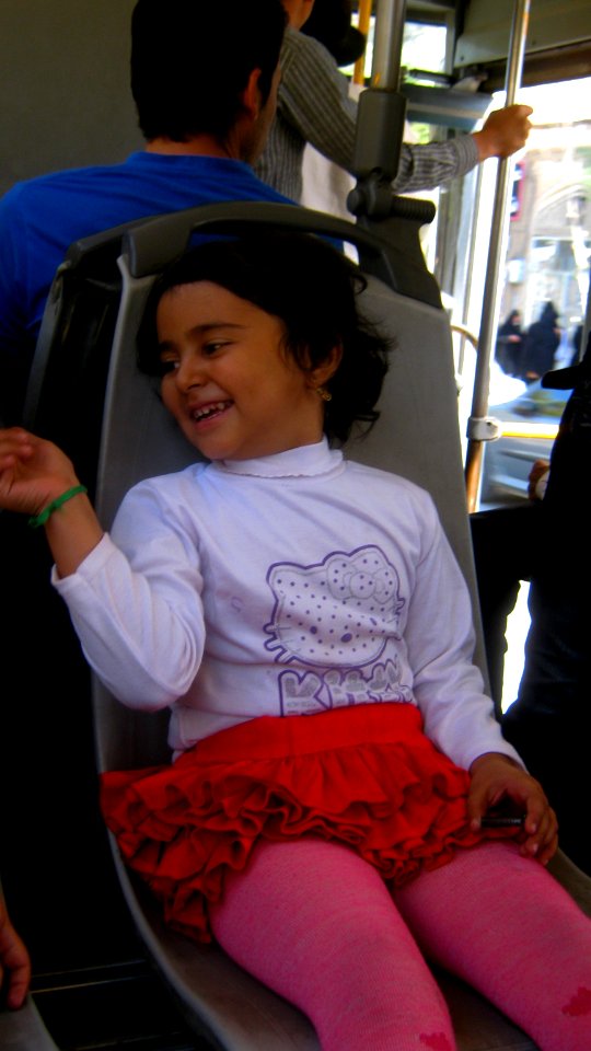 Happy girl sited on chair - morning - Nishapur 2