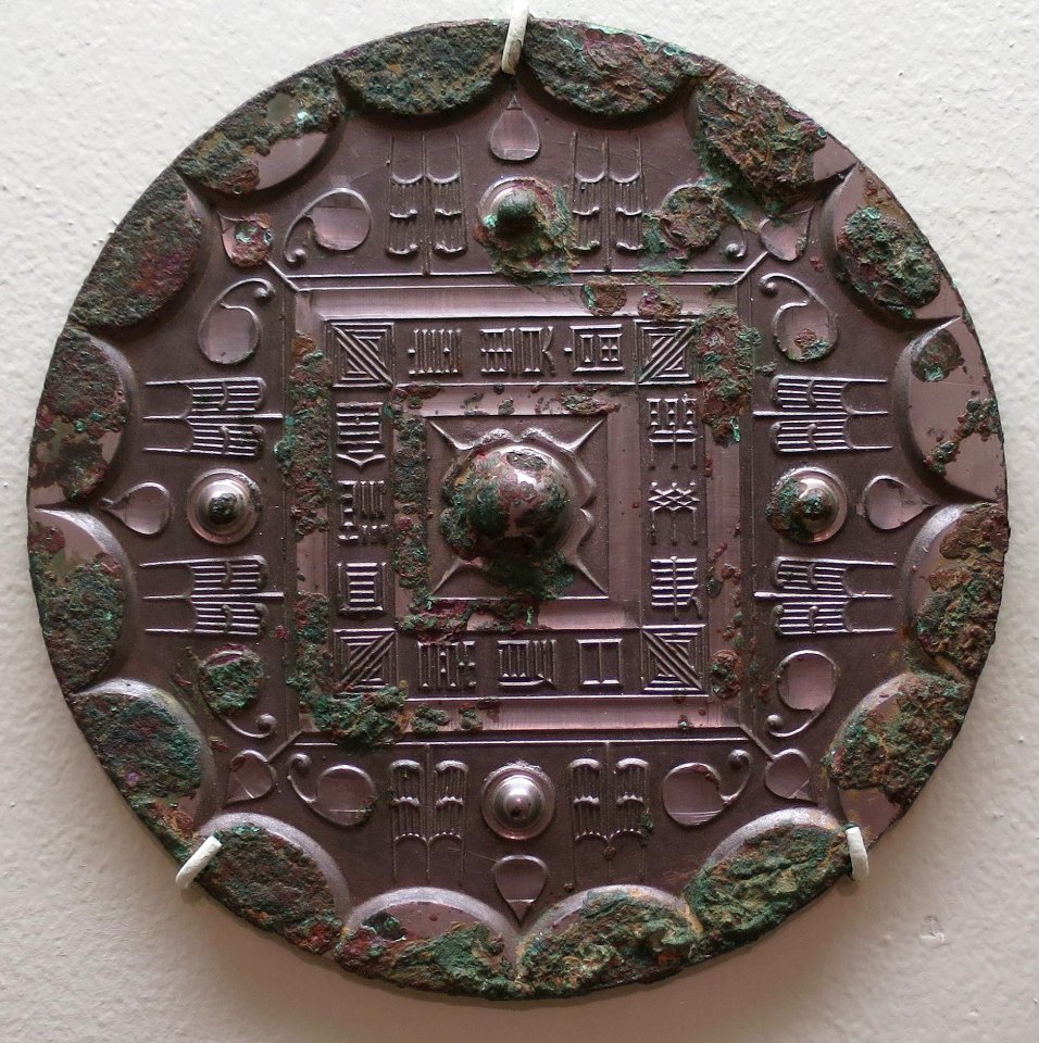 Han dynasty mirror, 206 BCE-222 CE, bronze, Lowe Art Museum