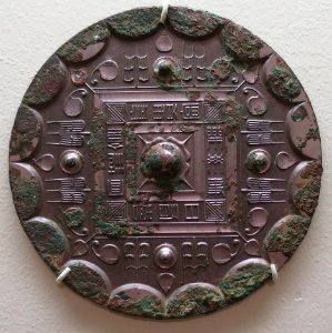 Han dynasty mirror, 206 BCE-222 CE, bronze, Lowe Art Museum