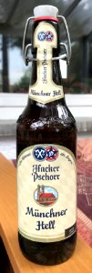 A bottle of Hacker-Pschorr Münchner Hell beer (2018 label).
