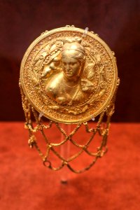 Hairnet with relief bust of Aphrodite at the National Archaeological Museum of Athens on 16 May 2018