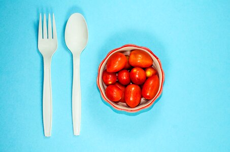 Tomato red cherry tomatoes spoon and fork