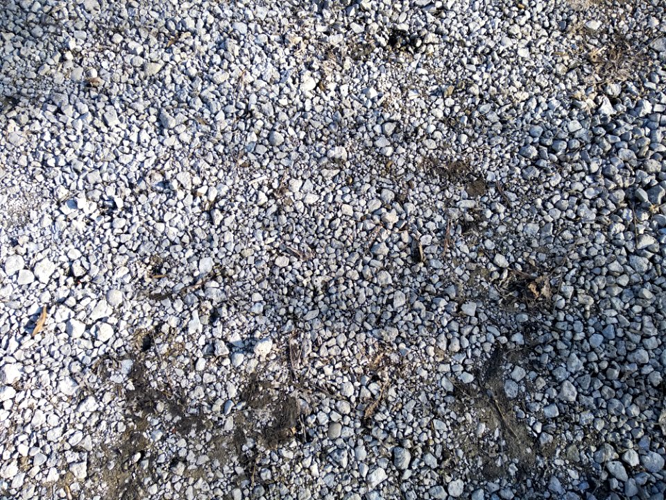 Gravel road with loose gravel closeup