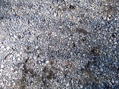 Gravel road with loose gravel closeup