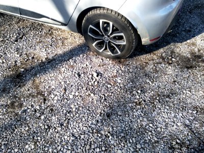 Gravel road, car in viewfield for scale photo