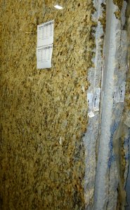 Granite slabs standing vertically in a warehouse