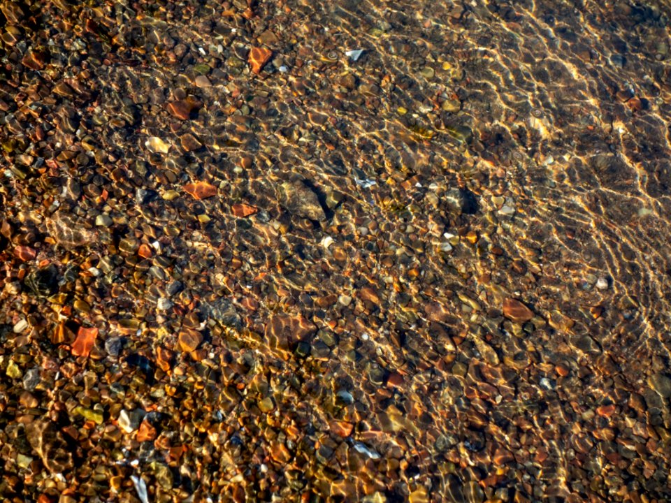 Granite gravel in shallow water 2