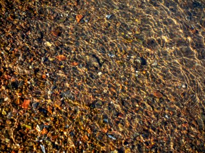Granite gravel in shallow water 2