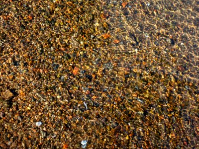 Granite gravel in shallow water 1
