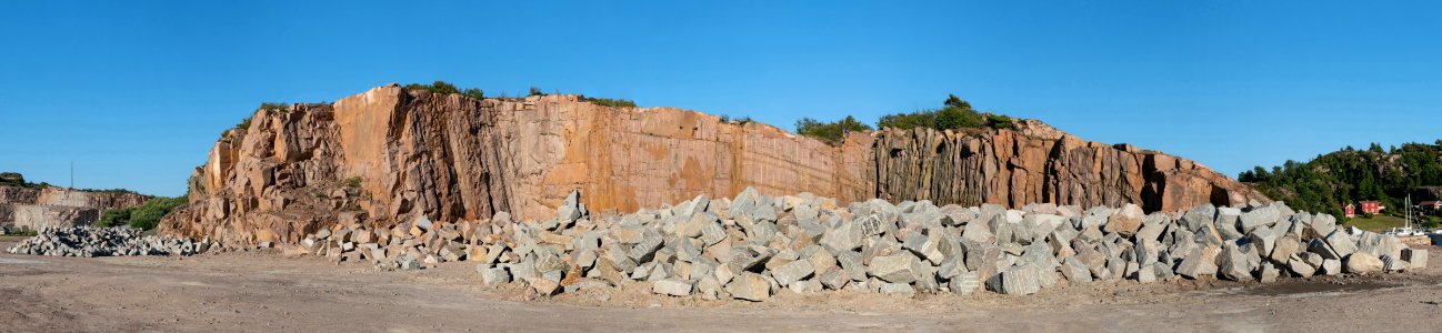 Gray granite rocks in front of red granite cliff in Rixö photo