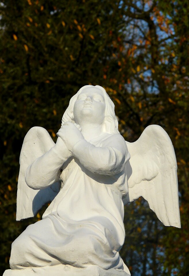 Statue autumn cemetery