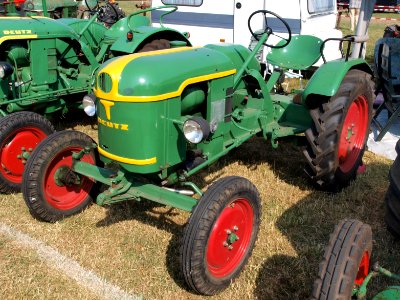 Green Deutz with red wheels