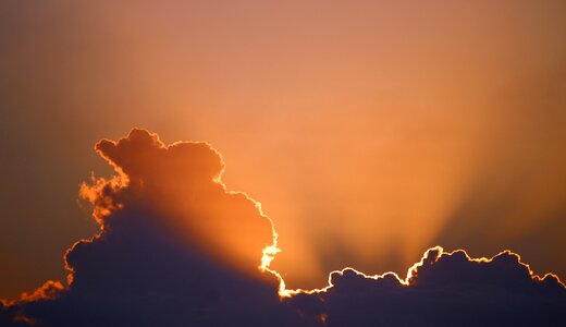 Dark cloud sunset glowing photo