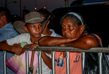 Grandmother and grandson waiting to see the image of Jesus in Jesus of Mercy photo