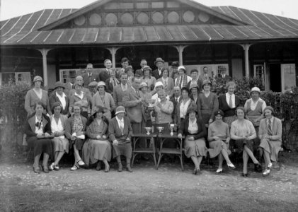 Group of golfers outside Llandrindod Wells Golf Club pavilion, one being presented with the Open Challenge Bowl, 1933 (1294269)