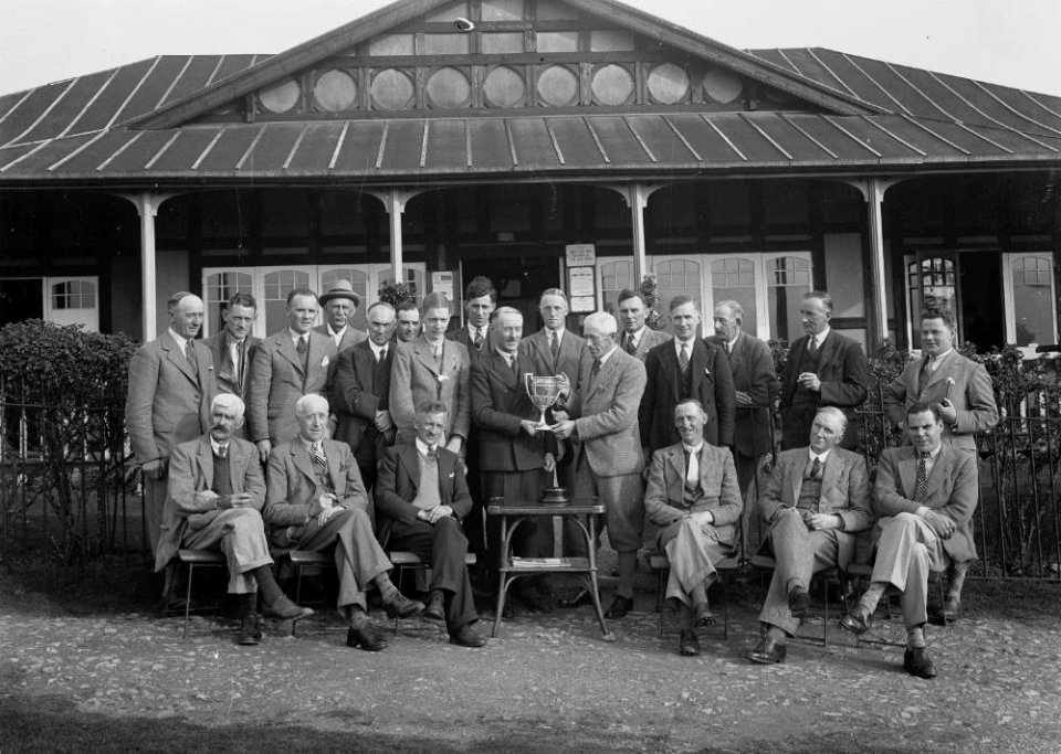Group of gentlemen golfers outside Llandrindod Golf Club pavilion at a trophy presentation (1293684)