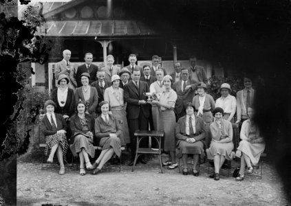 Group outside Llandrindod Wells Golf Club pavilion, with a lady golfer being presented with a cup (1294279)