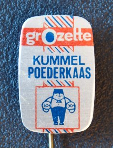 Grozette Kummel Poederkaas, reclame speldje