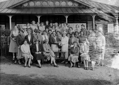 Group outside Llandrindod Wells Golf Club pavilion, with a lady golfer being presented with a cup (1293954)