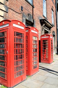 Group Of Three K6 Telephone Kiosks Outside British Telecom Exchange