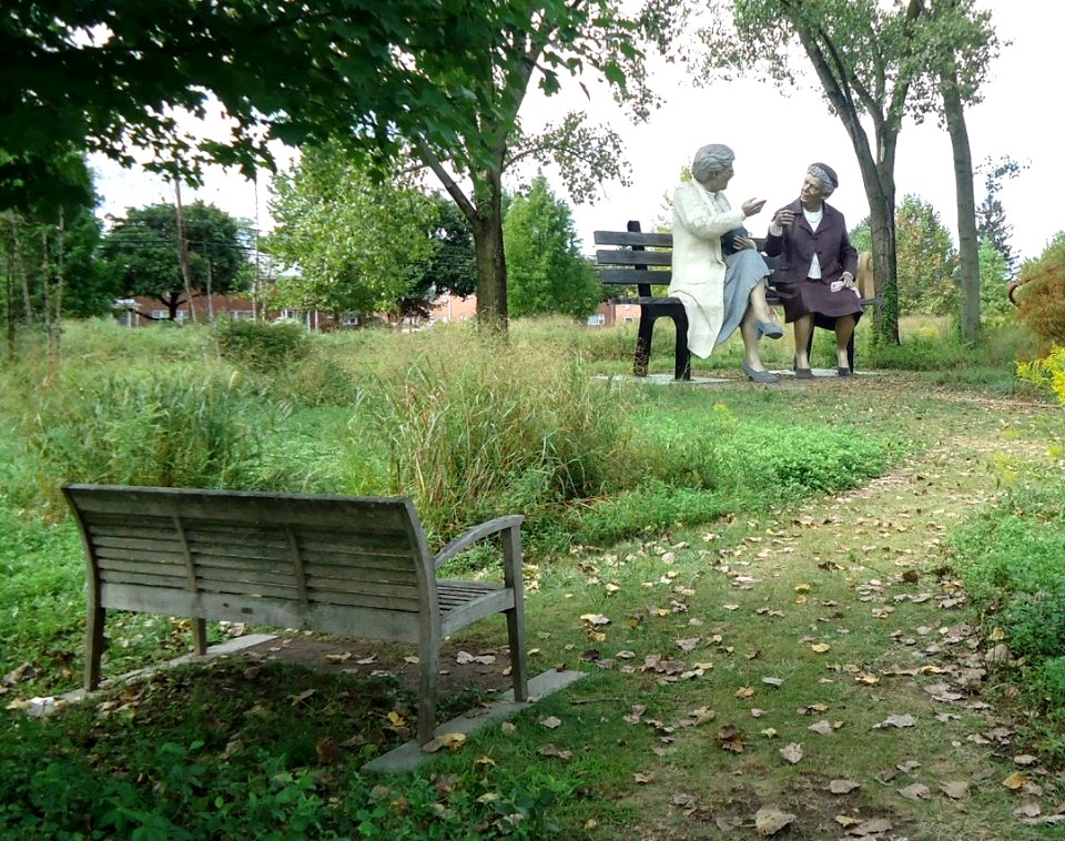 Grounds for Sculpture Two Sculptures Talking on bench