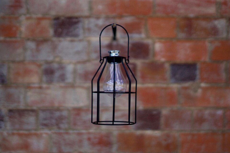 Brick wall background black lamp lantern photo