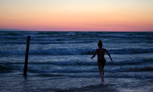 Girl running splash photo