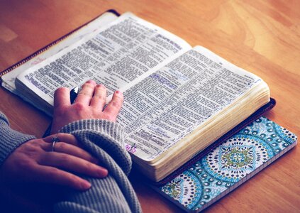 Open bible reading hands photo
