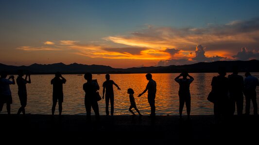 Sunset people silhouette photo