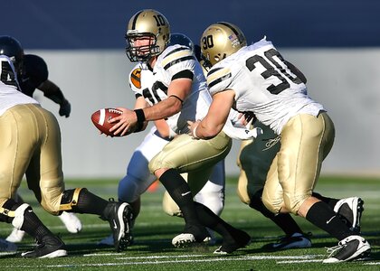 American football running back back photo