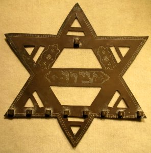 Hanukiah from India, early 20th century, engraved brass