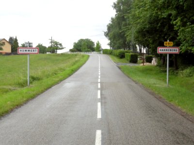 Harreberg and Hommert (Moselle) city limit signs, the road being the city limit