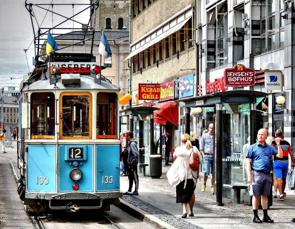 Hustle and bustle shopping street old tram
