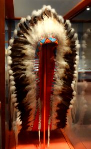Headdress owned by Sitting Eagle (John Hunter), Nakoda, early 1900s, front view, eagle feathers, rabbit fur, horsehair, hide, glass beads - Glenbow Museum - DSC00933