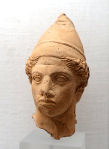 Head of a young man with felt cap (pilos), Magna Graecia, Taranto, late 5th to early 4th century BC, terracotta, H 237 - Martin von Wagner Museum - Würzburg, Germany - DSC05735 photo