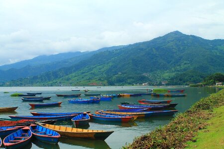 Colorful boats nepali himalayan mountains photo