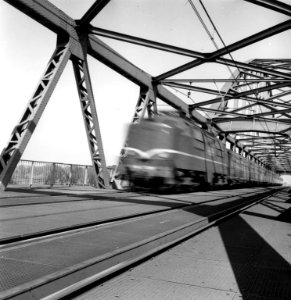 HUA-166612-Gezicht in de DEMKA brug over het Amsterdam Rijnkanaal te Utrecht met een passerende trein photo
