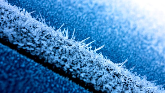 Hoar frost on a blue car 3 photo