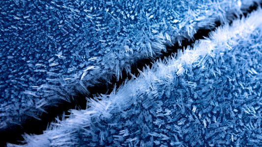 Hoar frost on a blue car 8 photo