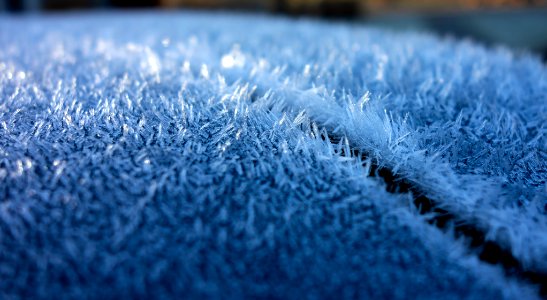 Hoar frost on a blue car 1 photo
