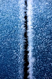 Hoar frost on a blue car 10 photo